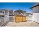 Outdoor deck with white railings overlooking neighborhood, providing space for relaxing and entertaining at 18211 E 51St Ave, Denver, CO 80249