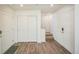 Bright entryway with wood floors, white doors, and easy access to the staircase at 18211 E 51St Ave, Denver, CO 80249