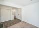 Inviting entryway featuring wood floors, white doors, and convenient closet space at 18211 E 51St Ave, Denver, CO 80249