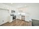Bright kitchen featuring stainless steel appliances, sleek countertops, and modern white cabinetry at 18211 E 51St Ave, Denver, CO 80249