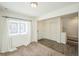 Bright living room with plush carpet, natural light, and easy access to the upper floor at 18211 E 51St Ave, Denver, CO 80249