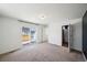 Spacious main bedroom with ample natural light, carpet and an attached bathroom at 18211 E 51St Ave, Denver, CO 80249