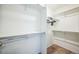 Walk-in closet with multiple shelves and bars for efficient storage and organization at 18211 E 51St Ave, Denver, CO 80249