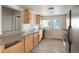 Functional kitchen with wood cabinets, stainless steel appliances, and spacious countertops at 3299 S Forest St, Denver, CO 80222