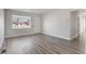Inviting living room with sleek flooring, large windows, and ample natural light at 3299 S Forest St, Denver, CO 80222
