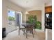 Cozy dining area next to balcony sliding doors and natural light at 1801 S Dunkirk St # 205, Aurora, CO 80017