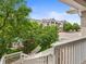 Exterior image of a well-maintained apartment complex with mature trees and landscaping at 1801 S Dunkirk St # 205, Aurora, CO 80017