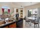 Open concept kitchen overlooks a cozy living room with a fireplace at 1801 S Dunkirk St # 205, Aurora, CO 80017