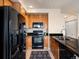 Modern kitchen boasts stainless steel appliances and tiled backsplash at 1801 S Dunkirk St # 205, Aurora, CO 80017