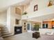 Spacious living room featuring a fireplace, and high ceilings at 1801 S Dunkirk St # 205, Aurora, CO 80017