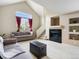 Inviting living room with a fireplace, and neutral colored furniture at 1801 S Dunkirk St # 205, Aurora, CO 80017