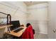 Walk-in closet with installed shelving and a desk for an office at 1801 S Dunkirk St # 205, Aurora, CO 80017