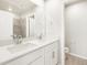 Bathroom features double sinks, large mirror and shower with gray tile at 791 N Tempe St, Aurora, CO 80018