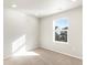 Well-lit bedroom with large window and plush carpet at 791 N Tempe St, Aurora, CO 80018