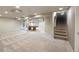Spacious finished basement with neutral carpet, pool table, and ample room for entertaining at 1264 Banner Cir, Erie, CO 80516