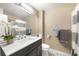 Bathroom with quartz countertop vanity, updated fixtures, and decorative accents at 1264 Banner Cir, Erie, CO 80516