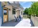 Inviting outdoor deck with patio furniture and yellow back door, offering a cozy exterior space at 1264 Banner Cir, Erie, CO 80516