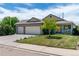 Inviting single-Gathering home with a lush lawn and a convenient three-car garage for ample parking at 1264 Banner Cir, Erie, CO 80516