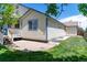 Back of the house shows a small wooden deck and lawn at 1264 Banner Cir, Erie, CO 80516