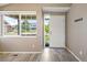 Bright foyer with hardwood floors, a large window, and a welcoming entrance, ideal for a modern home at 1264 Banner Cir, Erie, CO 80516