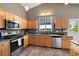 Well-equipped kitchen featuring granite countertops, stainless steel appliances, and ample wood cabinetry at 1264 Banner Cir, Erie, CO 80516