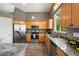 Updated kitchen with granite countertops, stainless steel appliances, and wooden cabinets at 1264 Banner Cir, Erie, CO 80516