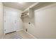 A functional laundry room features extra storage shelf space at 1264 Banner Cir, Erie, CO 80516