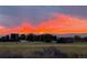 Spectacular sunset view over the Rocky Mountains creates a dramatic, scenic vista at 1264 Banner Cir, Erie, CO 80516