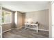 Cozy home office with modern desk, natural light from a window, and calming neutral color palette at 1264 Banner Cir, Erie, CO 80516