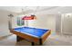 Recreational basement area featuring a well-lit pool table and bar accessories at 1264 Banner Cir, Erie, CO 80516