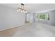 Bright living room with carpet flooring and large windows that flood the room with natural light at 17058 Hastings Ct, Parker, CO 80134