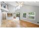 Open-concept living area featuring vaulted ceilings, hardwood floors, and seamless transition to the outdoor deck at 17058 Hastings Ct, Parker, CO 80134