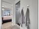 This bathroom features a shower stall with light grey towels on hooks at 19155 Robins Dr, Denver, CO 80249