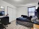 Bedroom featuring a white closet door and one window at 19155 Robins Dr, Denver, CO 80249