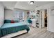 Bedroom features an alcove for dressing and closet access at 19155 Robins Dr, Denver, CO 80249