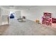 Large bonus room with carpet and plenty of space for entertaining or Gathering activities at 19155 Robins Dr, Denver, CO 80249