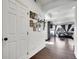 Bright hallway featuring wood floors, leading to a cozy living space at 19155 Robins Dr, Denver, CO 80249