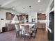 Open kitchen design featuring a large island with bar stool seating at 19155 Robins Dr, Denver, CO 80249