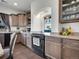 Well-equipped kitchen featuring granite countertops and dark wooden cabinetry at 19155 Robins Dr, Denver, CO 80249