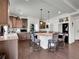 Spacious kitchen with a central island, granite countertops, breakfast bar, and stainless appliances at 19155 Robins Dr, Denver, CO 80249