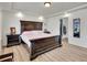 This bedroom boasts a tray ceiling and includes an attached bathroom with walk-in shower at 19155 Robins Dr, Denver, CO 80249
