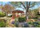 Serene backyard gazebo with vibrant flowers and lush greenery at 1439 S Emerson St, Denver, CO 80210