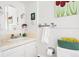 Clean bathroom with painted vanity, tiled backsplash, and classic fixtures for a timeless appeal at 1439 S Emerson St, Denver, CO 80210
