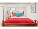 Basement bedroom with traditional bed frame, hardwood floors, and natural light at 1439 S Emerson St, Denver, CO 80210