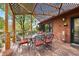 Relaxing outdoor dining area on wooden deck with lattice-covered pergola at 1439 S Emerson St, Denver, CO 80210