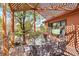 Outdoor dining area on wooden deck with glass table and elegant seating at 1439 S Emerson St, Denver, CO 80210