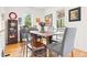 Charming dining room with hardwood floors, decorative art, and vintage shelving, perfect for entertaining at 1439 S Emerson St, Denver, CO 80210