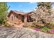 Well-maintained brick home with landscaped yard and charming front porch at 1439 S Emerson St, Denver, CO 80210