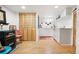 A kitchen features white cabinets, a small sink, and wood-look vinyl flooring at 1439 S Emerson St, Denver, CO 80210
