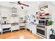 Bright kitchen with stainless appliances, farmhouse sink, open shelving, and a cozy breakfast nook at 1439 S Emerson St, Denver, CO 80210